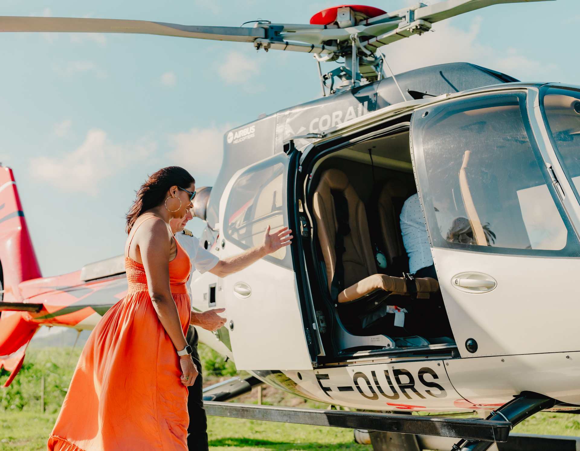 Lady arriving at bel ombre heliport after taking a helicopter transfer from the airport in Mauritius
